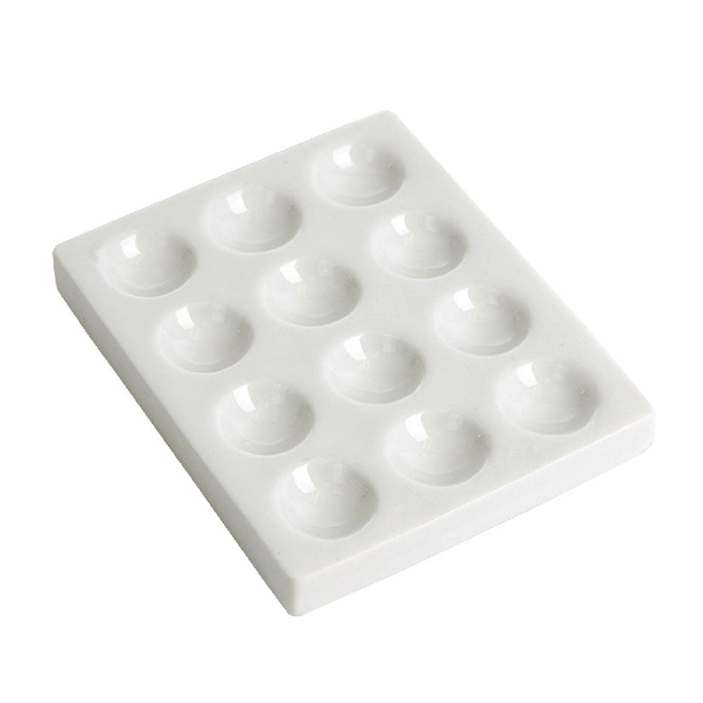 White plastic spotting tile with 12 cavities