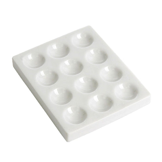 White plastic spotting tile with 12 cavities
